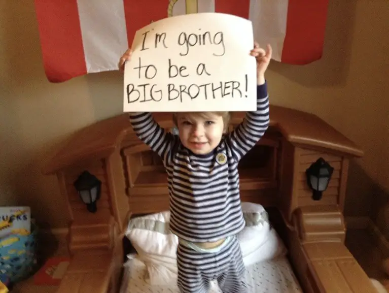 Asher announcing he's going to be a big brother, but not yet knowing it's a twins pregnancy.