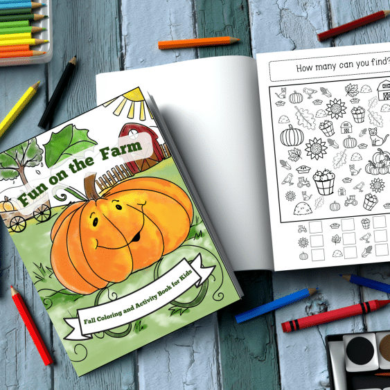 Fall Coloring and Activity Book for kids on a floor with an open copy of the book showing a picture find.